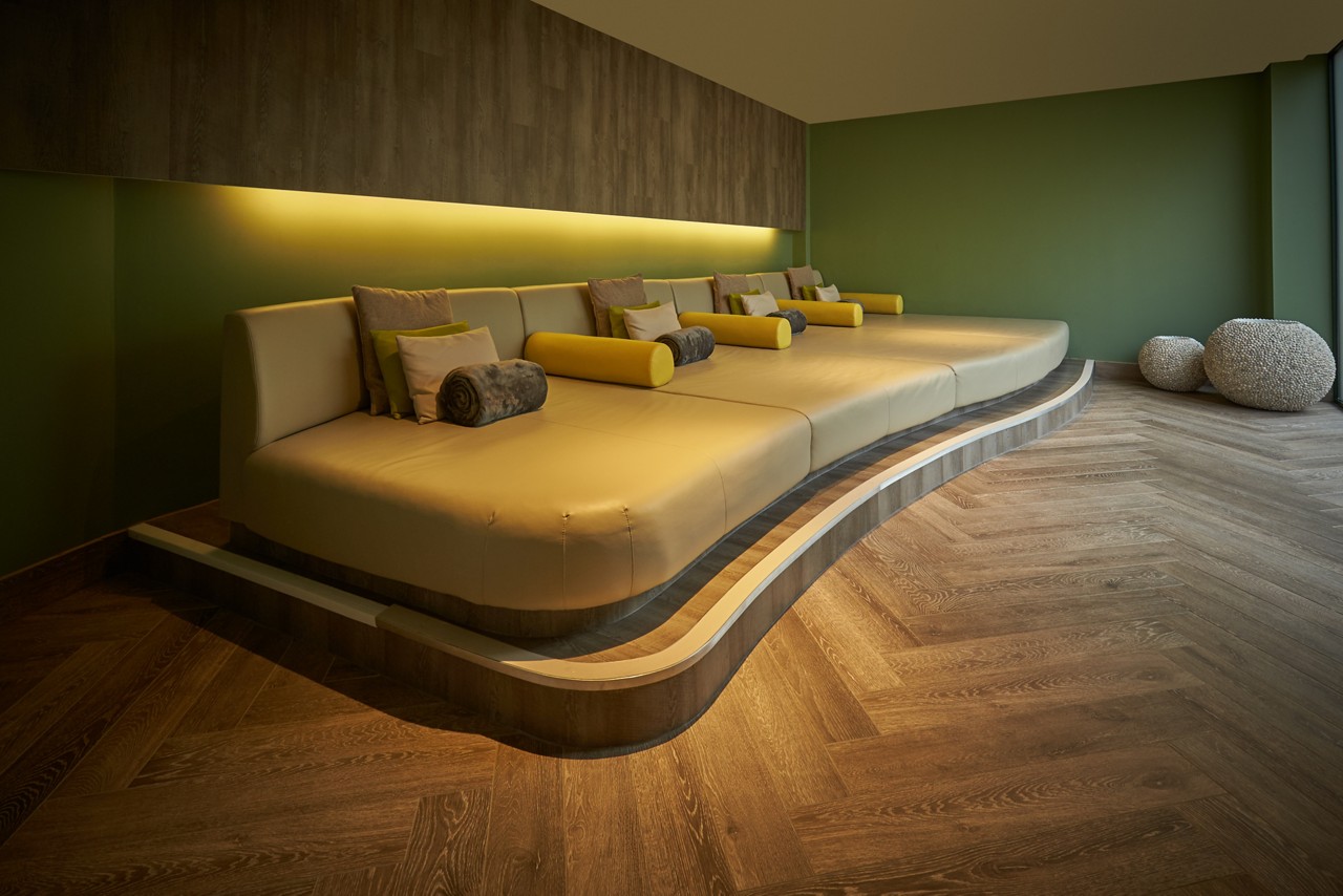 Cushioned lounging bed in the Forest View relax area.